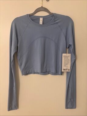 NWT Lululemon Blue Long-Sleeve Cropped Performance Top (size 10)